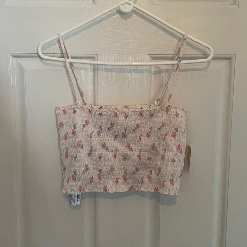 Straight cut cream crop top with faded designs